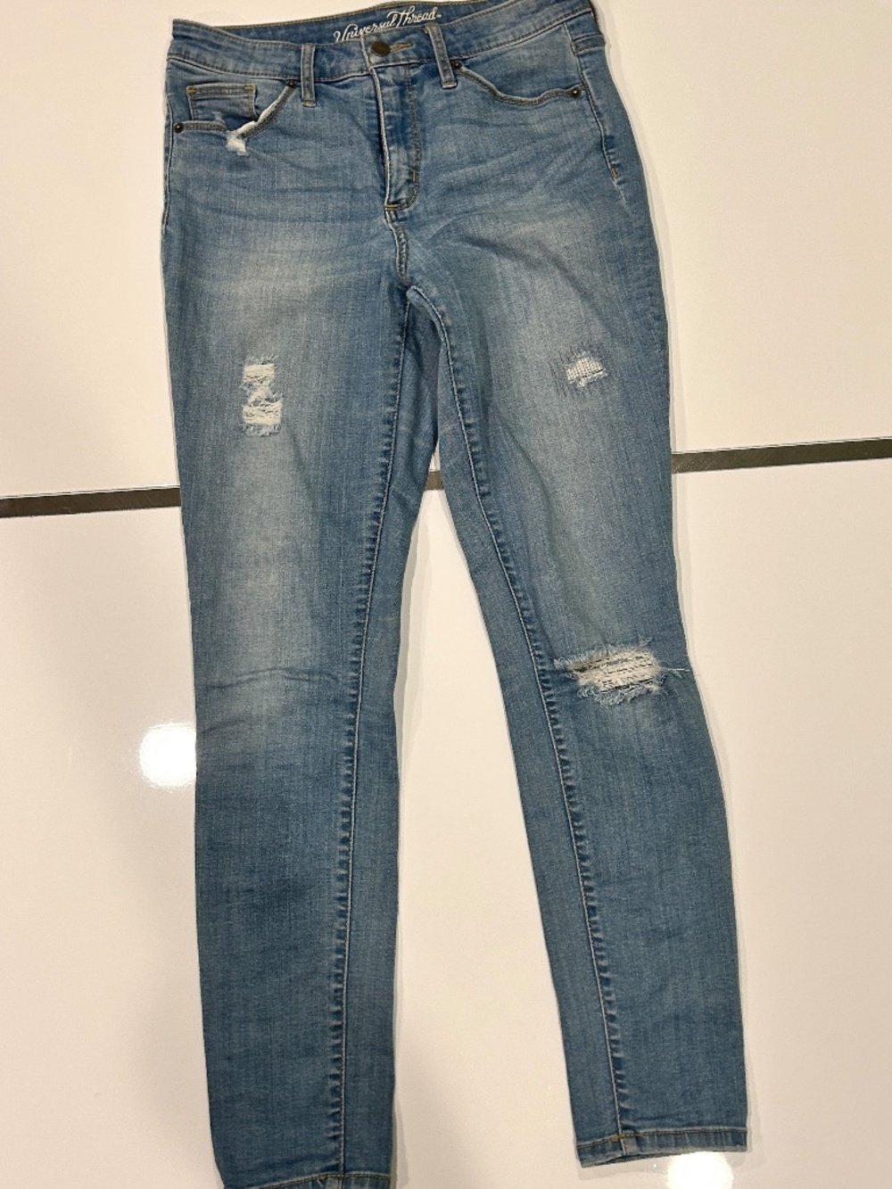 High rise medium-wash blue stretch skinny jeans
